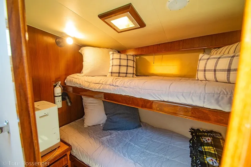 Slide: The Image of Cozy cabin with bunk beds in 1987 Hatteras 52 Convertible yacht interior. - 28