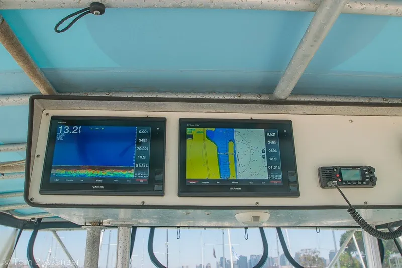 Slide: The Image of Garmin navigation displays on 1987 Hatteras 52 Convertible boat dashboard. - 45
