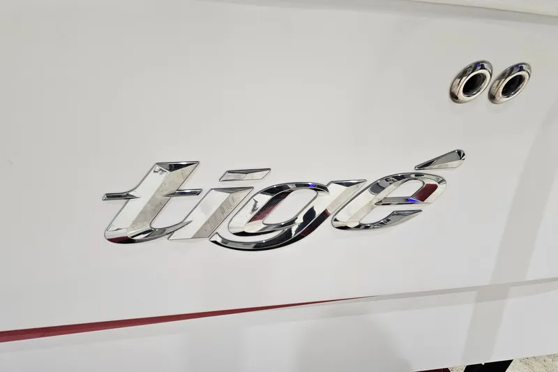 Slide: The Image of Chrome "Tigé" logo on a 2010 Tigé 22Ve boat hull. - 21