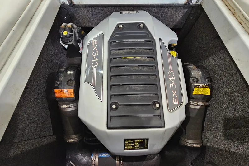 Slide: The Image of 2010 Tigé 22Ve boat engine, EX343 model, in a clean compartment. - 19