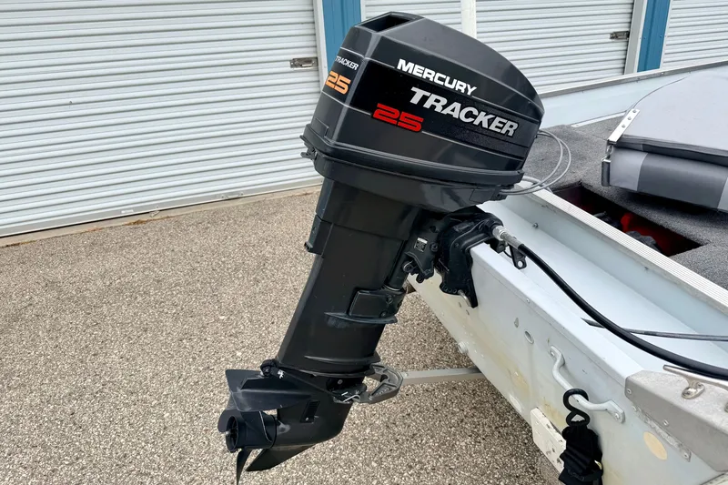 Slide: The Image of 1994 Tracker Guide V-14 boat with Mercury Tracker 25 outboard motor. - 13