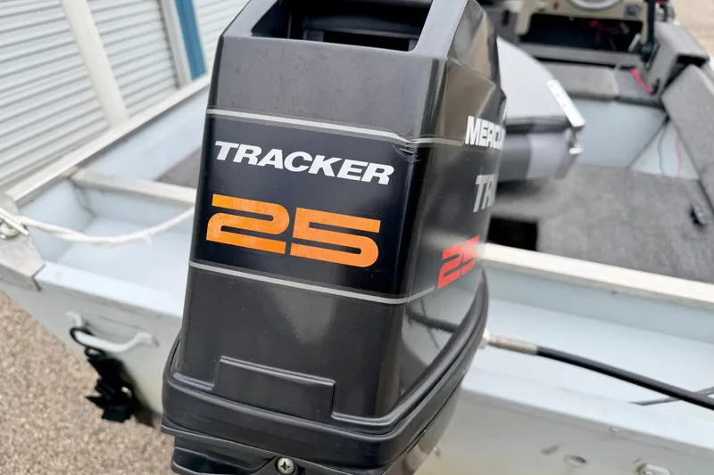 Slide: The Image of 1994 Tracker Guide V-14 Riveted Deep V boat with Mercury Tracker 25 engine. - 14