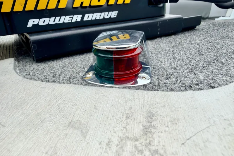 Slide: The Image of Navigation light on 1994 Tracker Guide V-14 Riveted Deep V boat deck. - 34