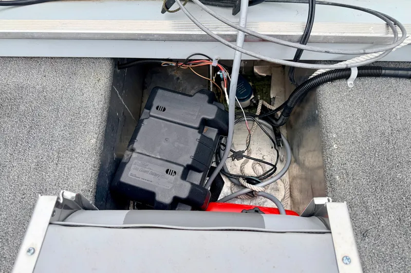 Slide: The Image of Battery compartment of a 1994 Tracker Guide V-14 Riveted Deep V boat. - 19