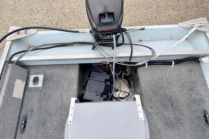 Slide: The Image of 1994 Tracker Guide V-14 Riveted Deep V boat interior with wiring and battery compartment. - 20