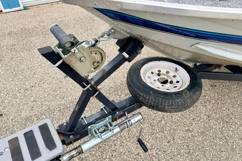 Slide: The Image of 1994 Tracker Guide V-14 boat on trailer with winch and spare tire. - 38