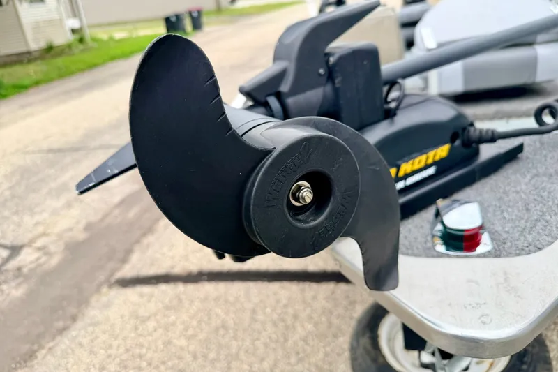 Slide: The Image of Close-up of a 1994 Tracker Guide V-14 boat's trolling motor propeller. - 35