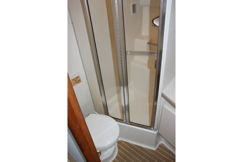 Slide: The Image of Bathroom interior of 1997 Silverton 351 Sedan yacht with shower and toilet. - 45
