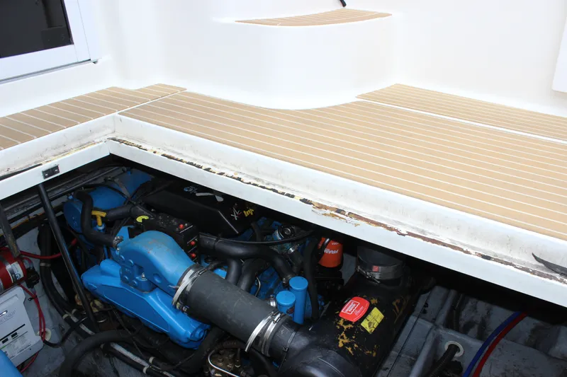 Slide: The Image of Engine compartment of a 1997 Silverton 351 Sedan boat, showcasing mechanical components. - 66