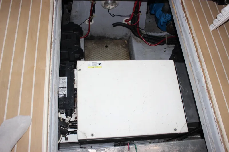Slide: The Image of Engine compartment of a 1997 Silverton 351 Sedan with visible wiring and components. - 69