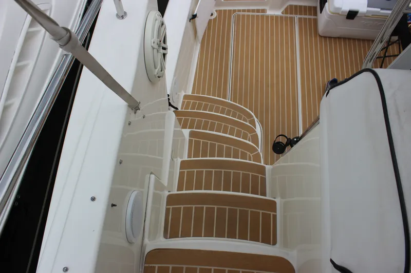 Slide: The Image of 1997 Silverton 351 Sedan boat interior with teak-style steps and deck. - 22