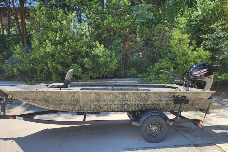 The Image of 2027 Grizzly 1654 T Sportsman boat on trailer with Mercury outboard motor. - 0