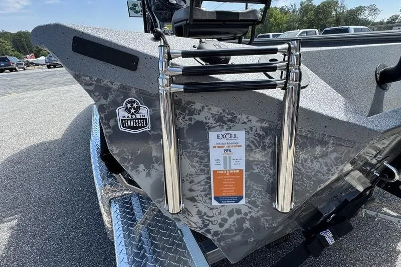 Slide: The Image of 2027 Excel 220 Bay Pro Elite boat with ladder and Tennessee sticker. - 17