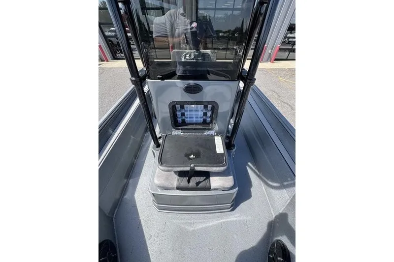 Slide: The Image of 2027 Excel 220 Bay Pro Elite boat interior with storage compartment and seating. - 22