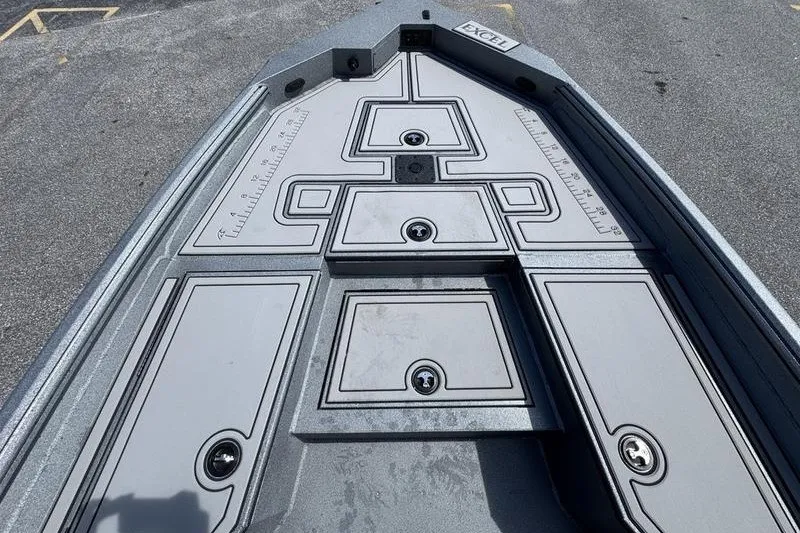 Slide: The Image of 2027 Excel 220 Bay Pro Elite boat deck with storage compartments and measurement guides. - 13