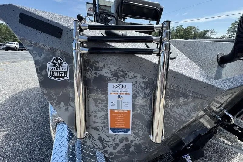 Slide: The Image of 2027 Excel 220 Bay Pro Elite boat with Tennessee emblem and ladder. - 19