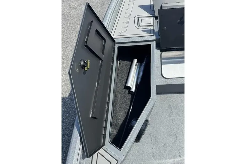 Slide: The Image of Open storage compartment on 2027 Excel 220 Bay Pro Elite boat deck. - 29