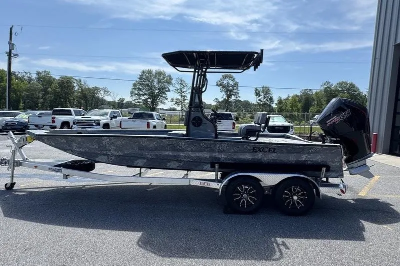 Slide: The Image of 2027 Excel 220 Bay Pro Elite boat on trailer, parked outdoors. - 20