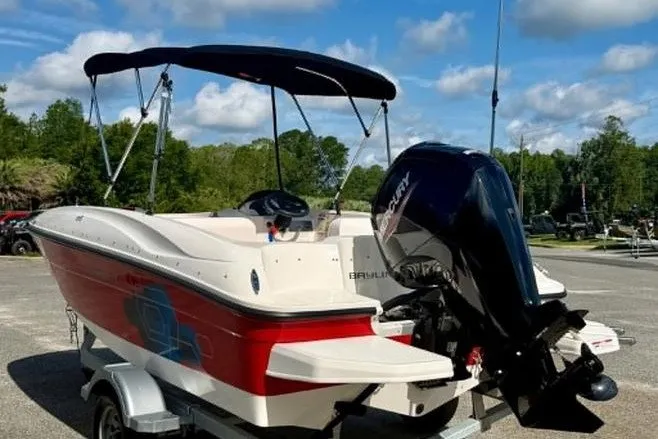 Slide: The Image of 2021 Bayliner Element E16 boat with canopy and Mercury outboard motor on trailer. - 7