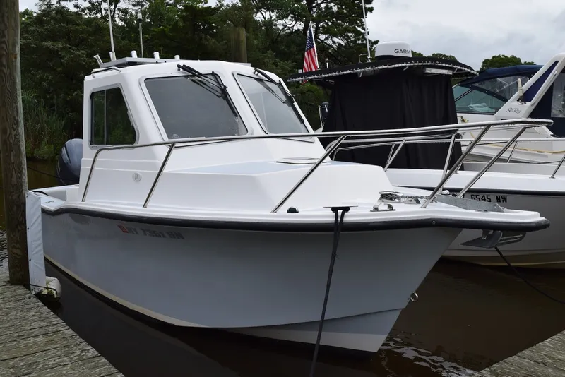 The Image of 2023 NorthCoast 215 HT boat docked, featuring sleek design and modern amenities. - 1