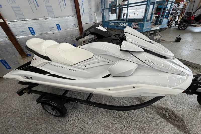 The Image of 2026 Yamaha WaveRunner FX Cruiser SVHO in a showroom, displayed on a trailer. - 1