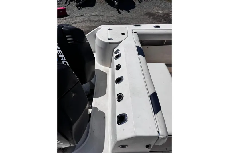 Slide: The Image of 2001 Boston Whaler 23 Outrage boat interior with seating and engine view. - 20