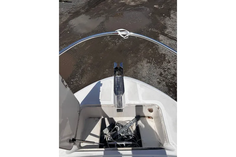 Slide: The Image of Bow view of a 2001 Boston Whaler 23 Outrage with anchor storage. - 15