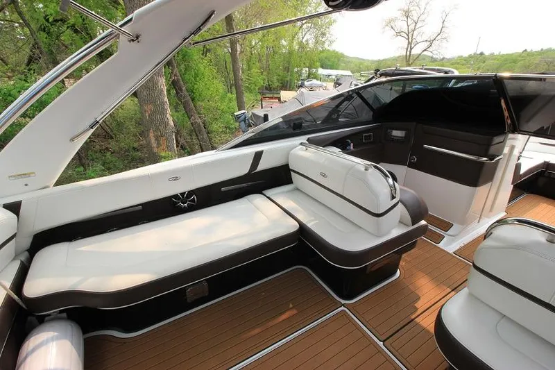 Slide: The Image of The image shows the cockpit of a 2016 Regal 2800 Bowrider with sleek seating and wood flooring. - 8