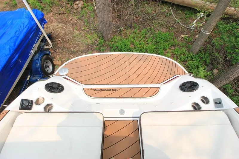 Slide: The Image of The image shows the stern of a 2016 Regal 2800 Bowrider with wood-patterned flooring. - 6