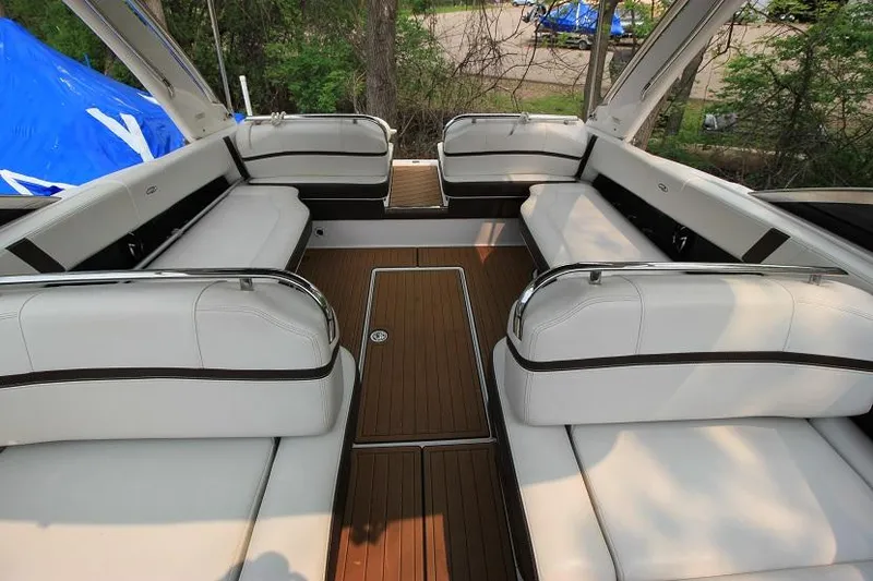 Slide: The Image of The image shows the cockpit of a 2016 Regal 2800 Bowrider with white upholstery. - 19