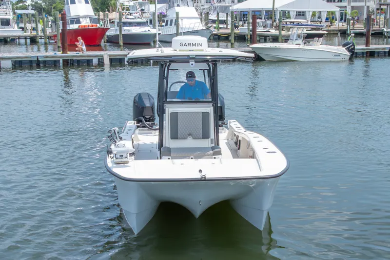 Slide: The Image of Calcutta 263 boat from 2026 docked at marina, featuring Garmin equipment. - 14