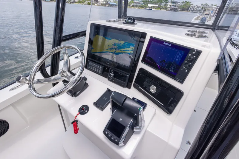 Slide: The Image of Helm of 2026 Calcutta 263 boat with advanced navigation displays and controls. - 55