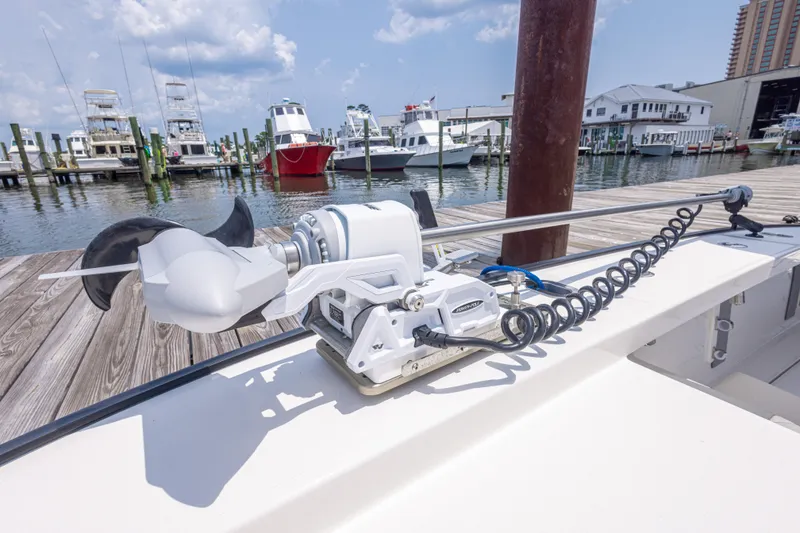Slide: The Image of Calcutta 263 boat with advanced trolling motor docked at marina, 2026 model. - 44