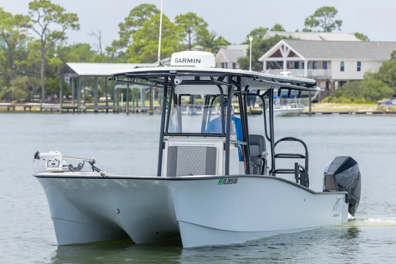 Slide: The Image of 2026 Calcutta 263 boat on water, featuring Garmin equipment, with scenic background. - 17