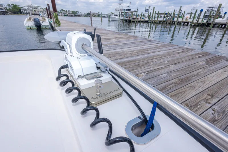 Slide: The Image of Boat docked with anchor system on Calcutta 263, 2026 model, near wooden pier. - 52