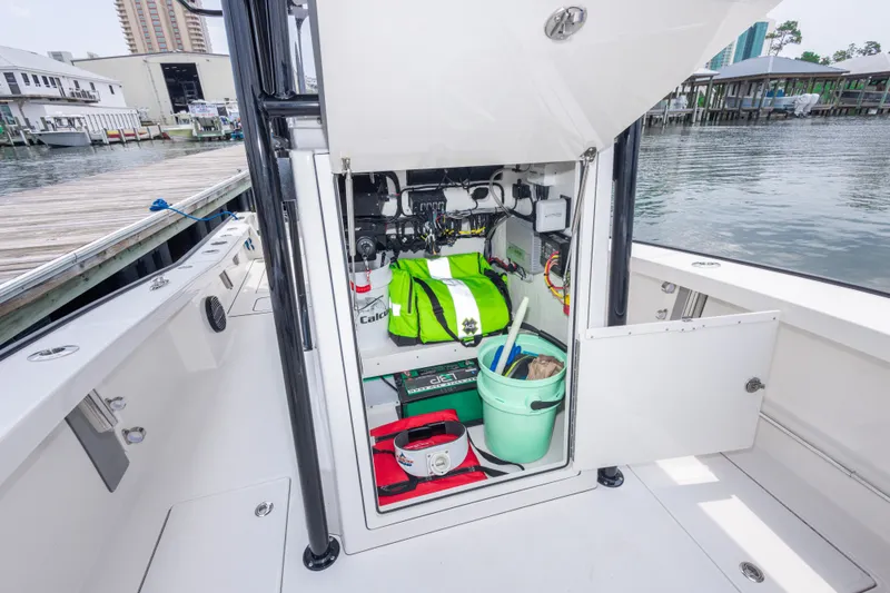 Slide: The Image of Open storage compartment on Calcutta 263 boat, showcasing organized gear and equipment. - 37