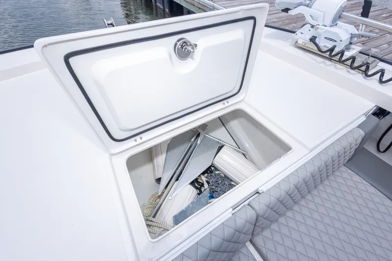 Slide: The Image of Open storage compartment on 2026 Calcutta 263 boat, showing anchor and rope. - 41