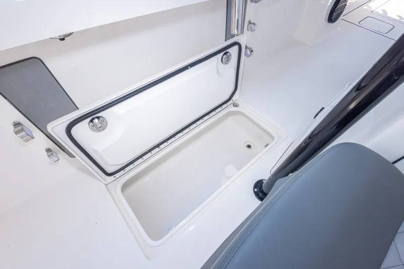Slide: The Image of Open storage compartment on 2026 Calcutta 263 boat, featuring sleek white interior design. - 46