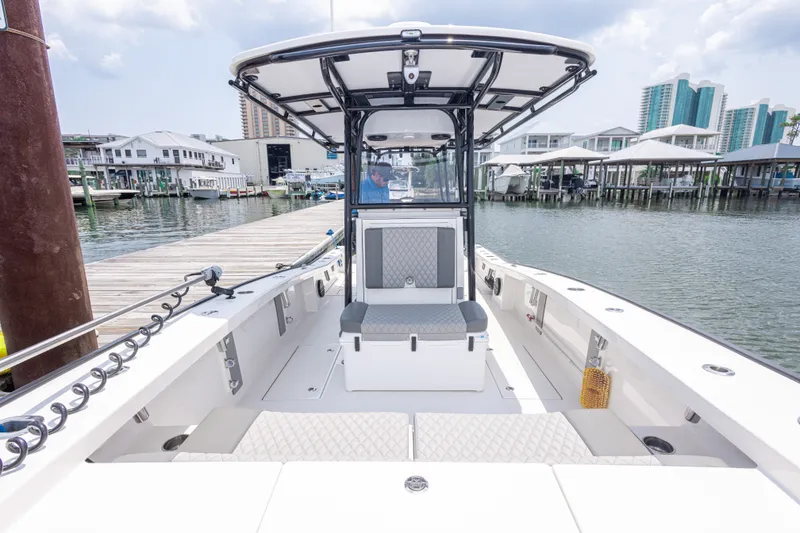 Slide: The Image of Calcutta 263 boat docked at marina, showcasing spacious deck and modern design, 2026 model. - 42
