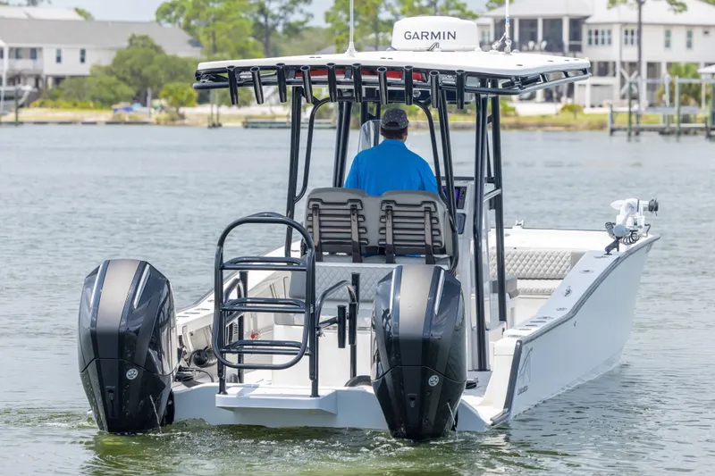 Slide: The Image of Calcutta 263 boat on water, featuring dual engines and Garmin navigation, 2026 model. - 27