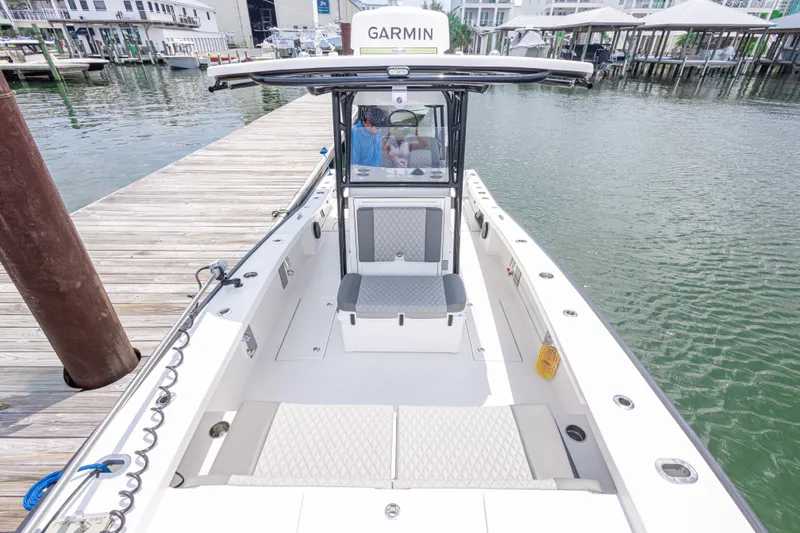 Slide: The Image of Calcutta 263 boat docked, featuring spacious deck and Garmin equipment, 2026 model. - 43