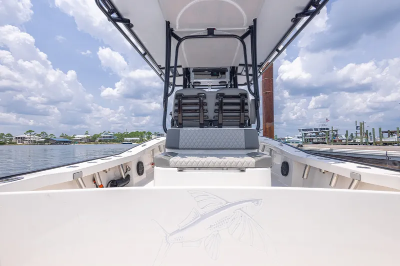 Slide: The Image of Calcutta 263 boat interior, 2026 model, featuring seating and ocean view under cloudy sky. - 70
