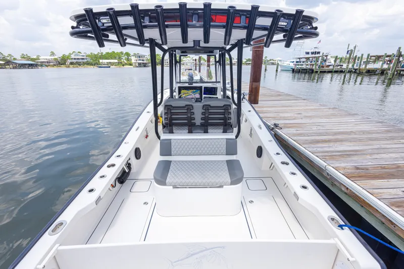 Slide: The Image of Calcutta 263 boat interior, 2026 model, docked at a marina with seating and console. - 69