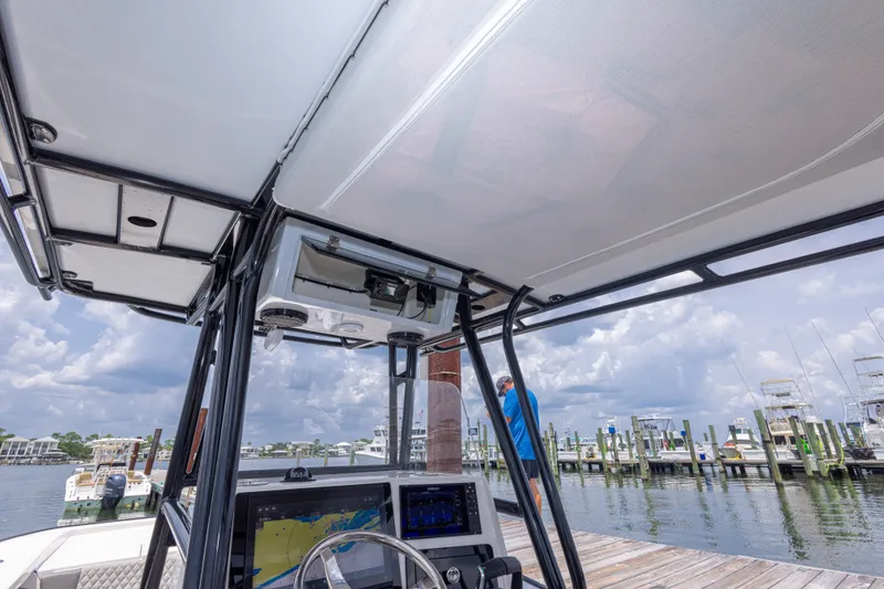 Slide: The Image of Calcutta 263 boat interior, 2026 model, docked at marina with cloudy sky. - 71