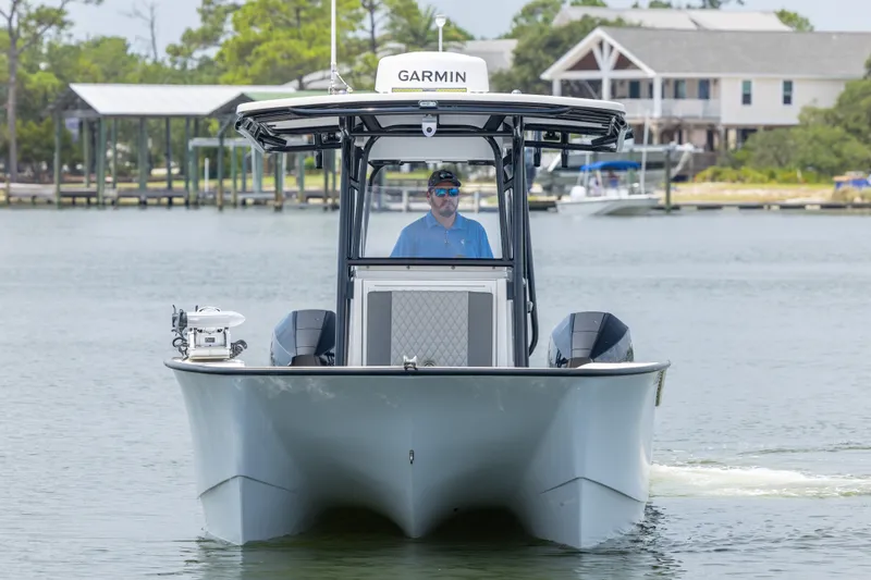 Slide: The Image of Front view of 2026 Calcutta 263 boat on water with Garmin equipment. - 18