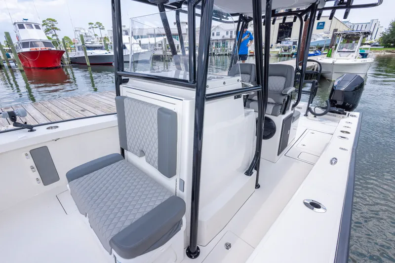 Slide: The Image of 2026 Calcutta 263 boat interior with gray seating, docked at marina. - 50