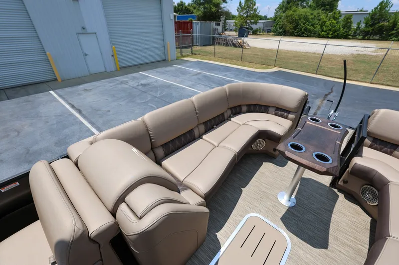 Slide: The Image of 2023 Bennington Q 25 QFBA pontoon boat with luxurious seating and cup holders. - 16