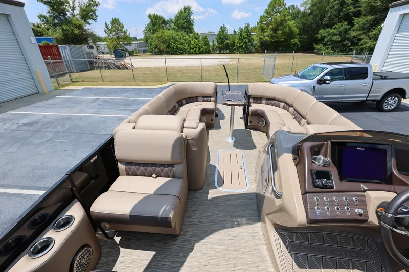 Slide: The Image of 2023 Bennington Q 25 QFBA pontoon boat interior with luxurious seating and modern dashboard. - 15
