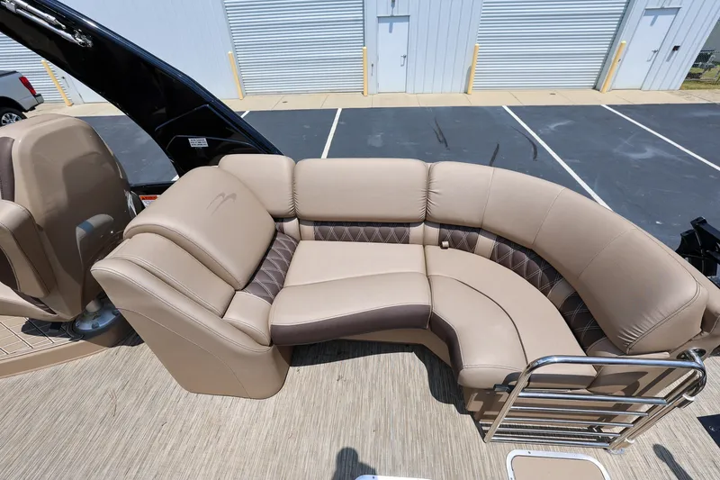 Slide: The Image of Luxurious seating on 2023 Bennington Q 25 QFBA pontoon boat, featuring plush beige upholstery. - 9