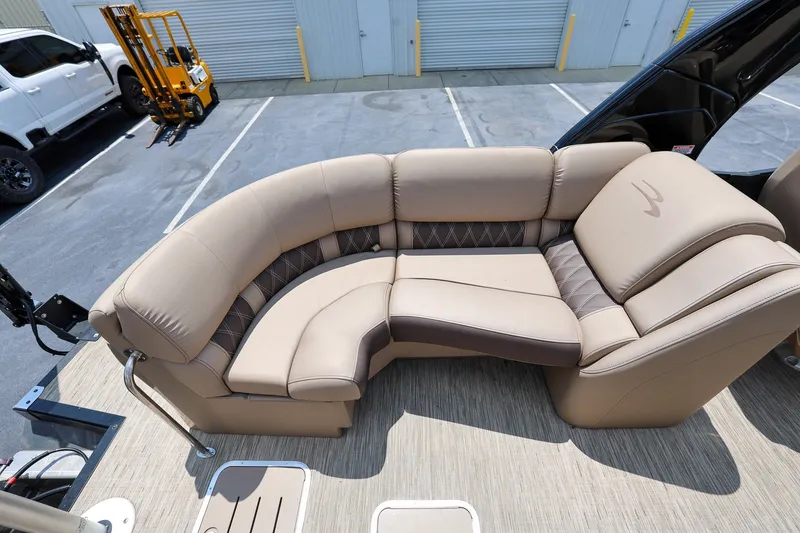 Slide: The Image of Luxurious seating on 2023 Bennington Q 25 QFBA pontoon boat, featuring beige upholstery. - 8